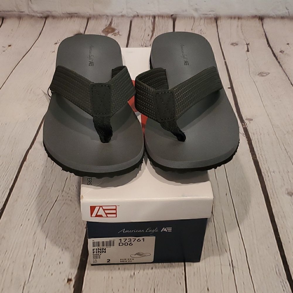 Boy's new in box grey and black American Eagle flip flops